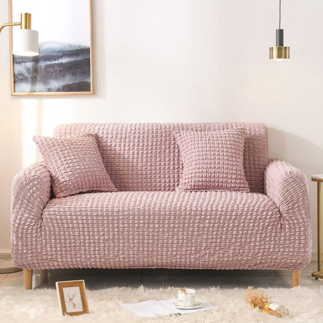 Seduta imbottita rosa con braccioli